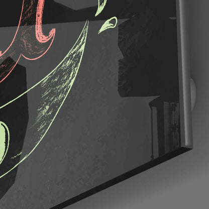 Close-up angled view of black canvas with neon pink and yellow-green botanical line drawings and text details.