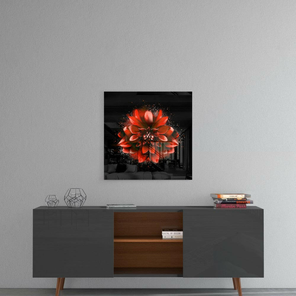 Red lotus glass wall art displayed above a mid-century modern console table with geometric decor and stacked books.