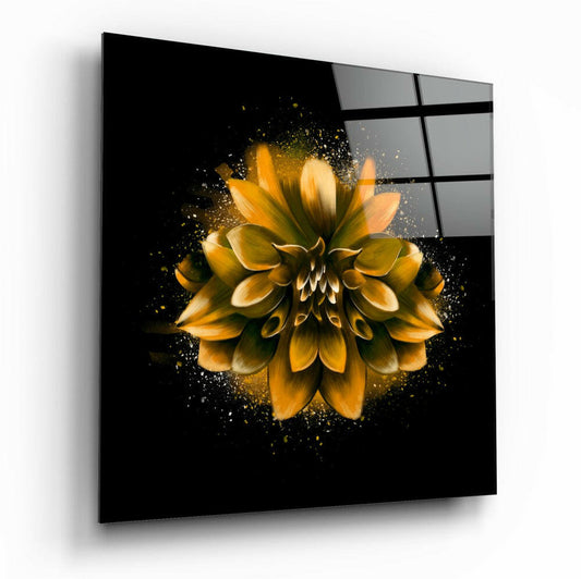 Angled perspective view of a glass wall art panel displaying a golden yellow lotus flower with particle effects on black background.