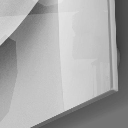 Close-up angled view of frosted glass wall art with embossed lip design, mounted on white wall surface.