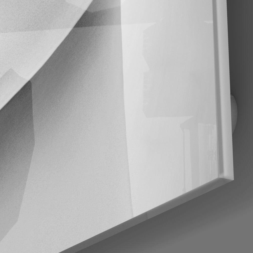 Close-up detail of white frosted glass wall art showing embossed lip design and beveled edge against neutral background.