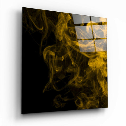 Angled perspective view of black glass wall art panel with golden yellow smoke swirls and horizontal rectangular sections.