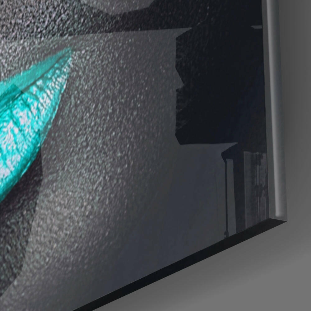 Side angle view of turquoise lashes design on textured glass wall art panel mounted on white wall.