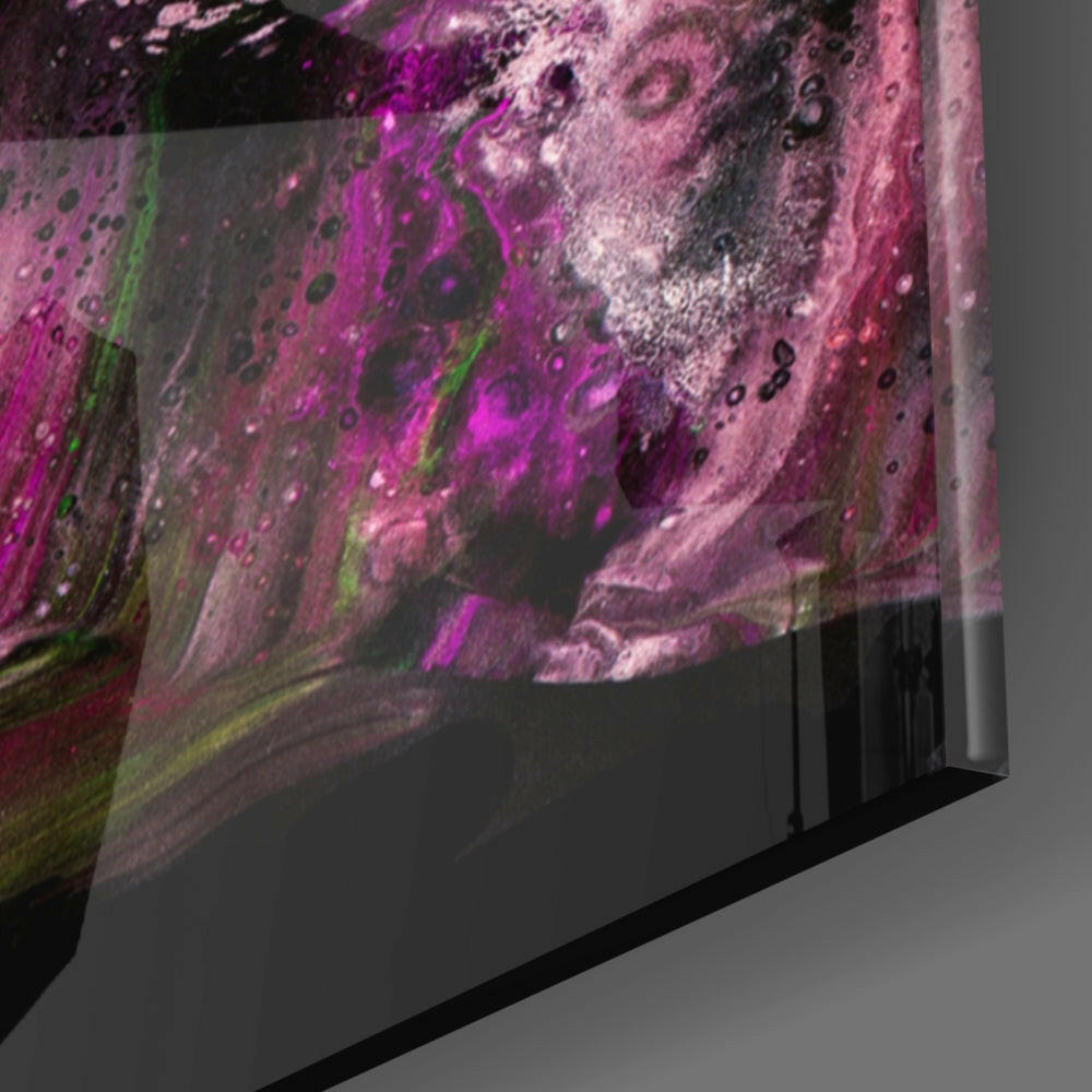Angled side view of glass wall art panel displaying swirling magenta, pink, and green fluid patterns with textured surface detail.