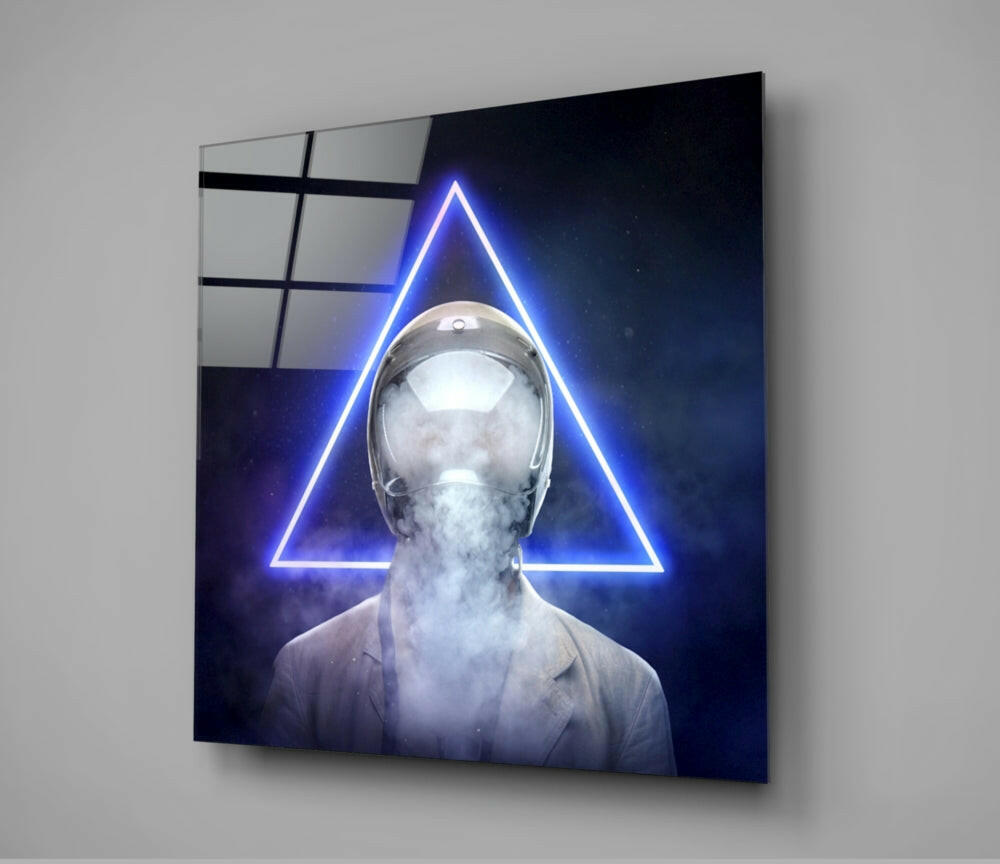 Glass wall art depicting a figure with glowing blue neon triangle behind head against dark starry background.
