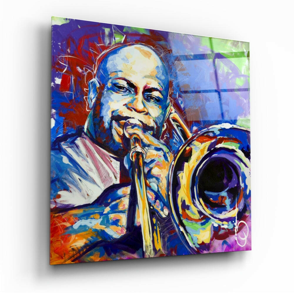 Colorful glass wall art depicting a musician playing trombone, displayed at an angle with vibrant blue, red, and yellow tones throughout the composition.