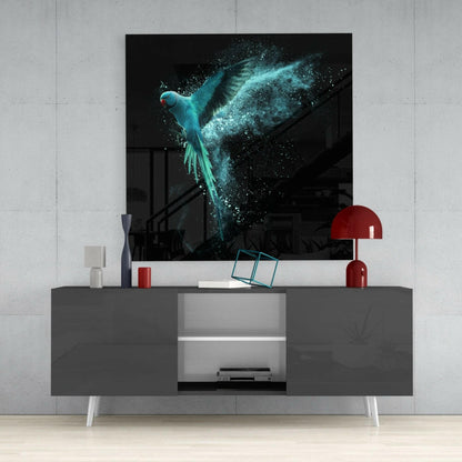 Turquoise glowing parrot with dispersing particles displayed as wall art above gray media console with red accents.