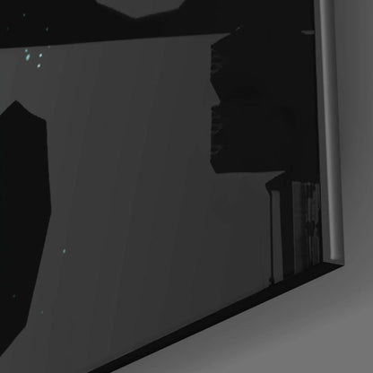 Close-up side view of black glass wall art panel mounted on gray wall, showing edge detail and reflective surface.