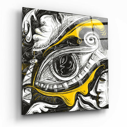 Three-quarter angled view of black and white line-drawn faces with intricate mechanical eye detail in yellow accent, printed on glass wall art panel.