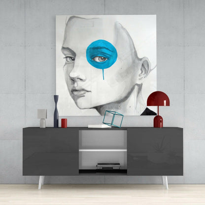 Modern interior display featuring Blue Look Glass Wall Art mounted above a gray media console with red decorative accessories and geometric objects.