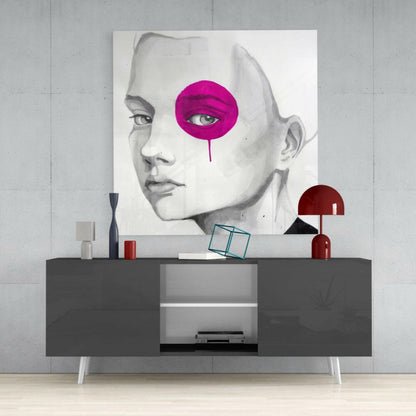 Modern interior display featuring a grayscale portrait with a bright magenta circular design, mounted above a dark console table with red accents.