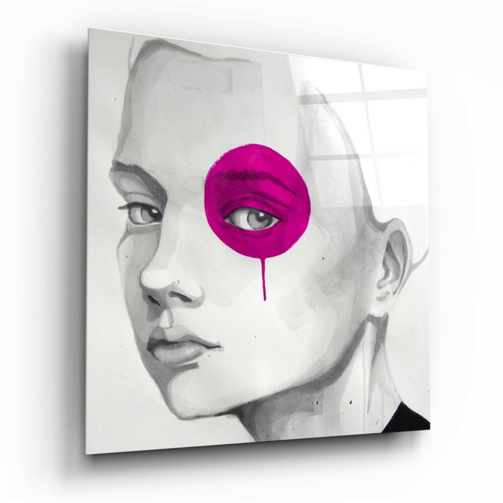 Angled view of canvas wall art featuring a grayscale portrait with a bright magenta circular overlay covering one eye.