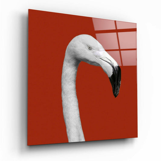 White flamingo head with black beak in profile against bright red glass panel with grid pattern.