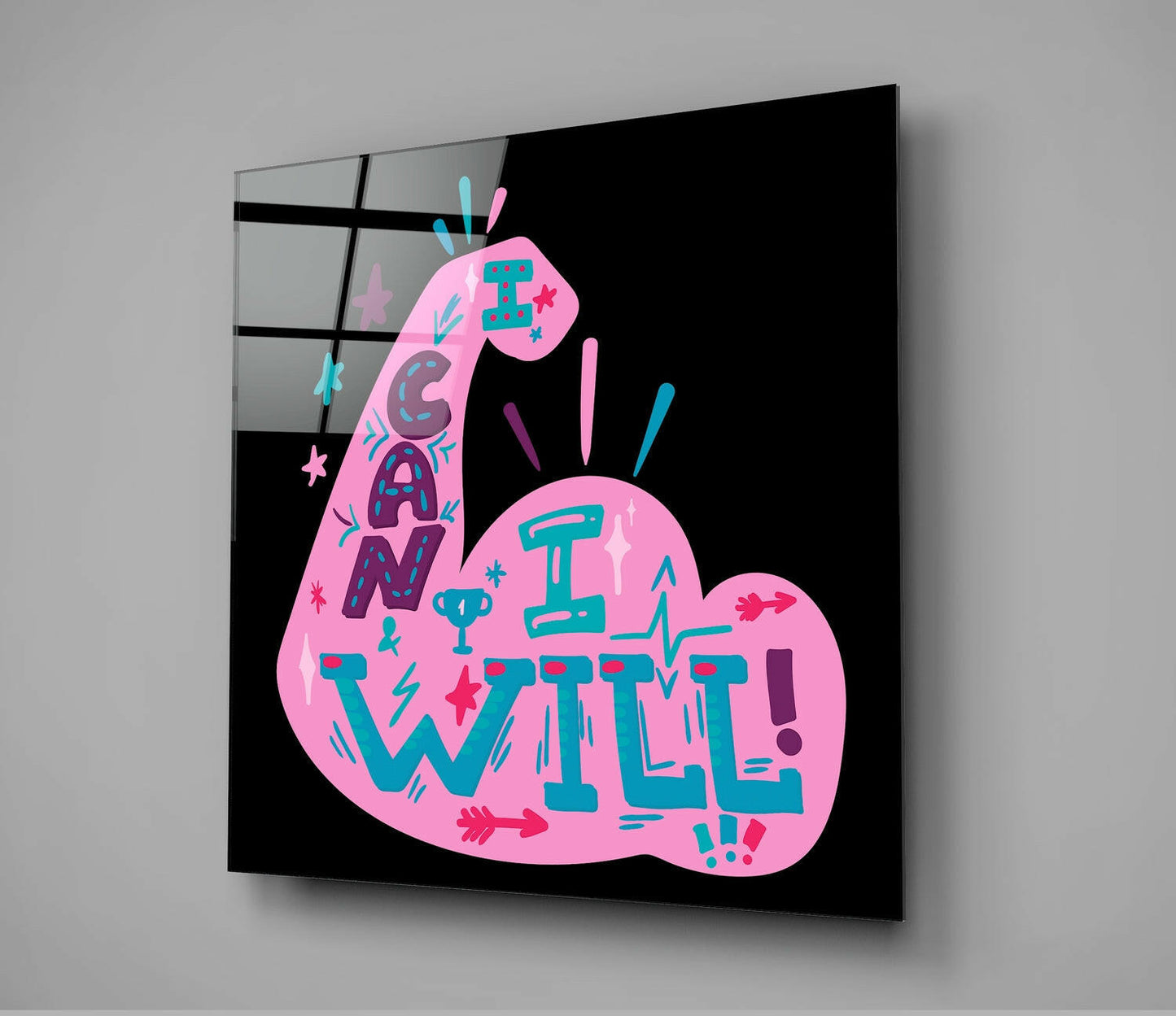 Pink glass wall art with teal and magenta text reading "I CAN I WILL" against black background, displayed at an angle.