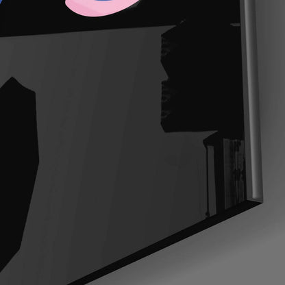 Close-up angled view of frosted glass wall art with black text and pink curved design element against gray background.