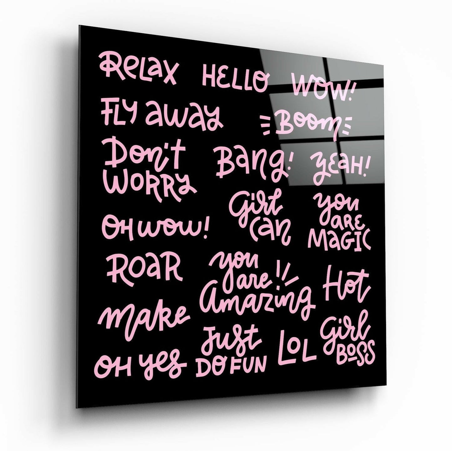 Black glass wall art panel displaying pink handwritten-style text with motivational phrases including "Relax," "Girl Boss," and "You are Magic," shown at a three-quarter angle.