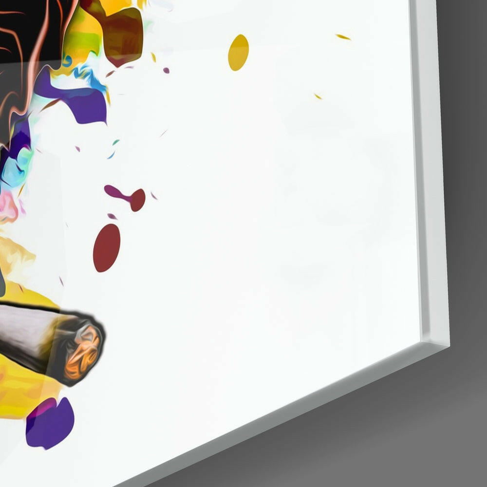 Colorful glass wall art panel with abstract painted design featuring purple, yellow, red, and blue flowing shapes against white background, angled three-quarter view.