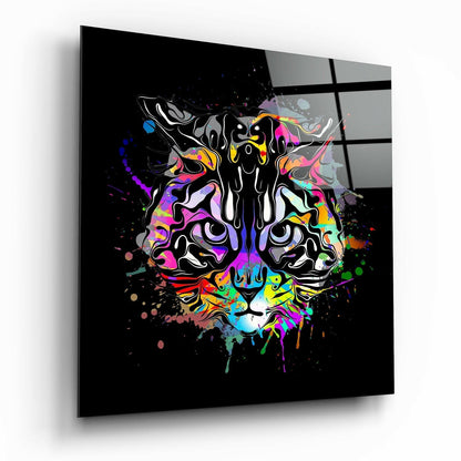 Angled view of black glass wall art featuring a colorful neon tiger face with vibrant splatter effects against dark background.