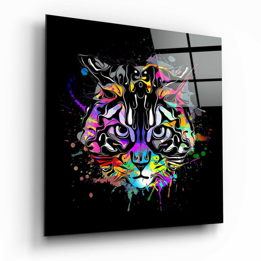 Angled view of black glass wall art featuring a colorful neon tiger face with vibrant splatter effects against dark background.