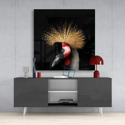 Black Crowned Crane portrait with distinctive golden crest and red face markings displayed as wall art above grey media console.