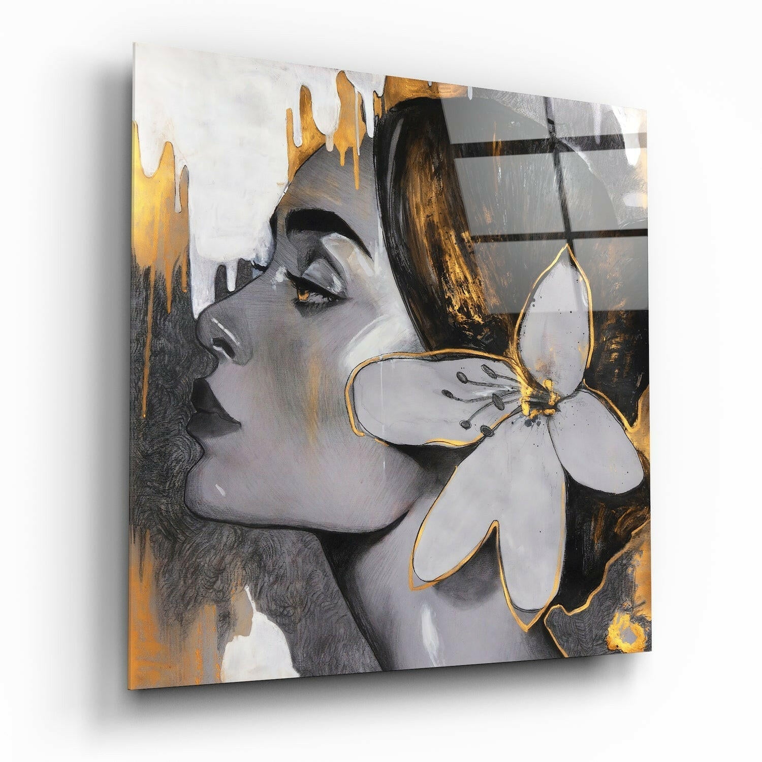 Angled side view of glass wall art depicting a woman's profile with gold leaf accents and a white flower, displayed against white background.