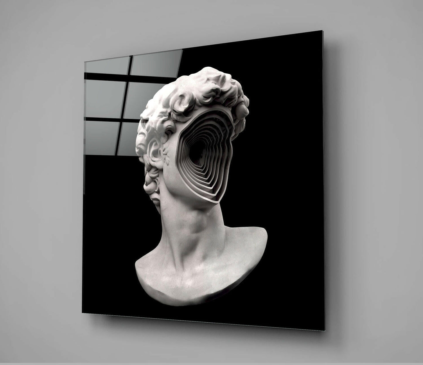 White plaster classical bust with concentric circular void through face, displayed on black background glass panel.