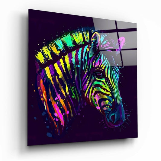 Angled three-quarter view of neon splatter zebra portrait on dark purple glass panel with vibrant yellow, cyan, magenta, and orange paint streaks.
