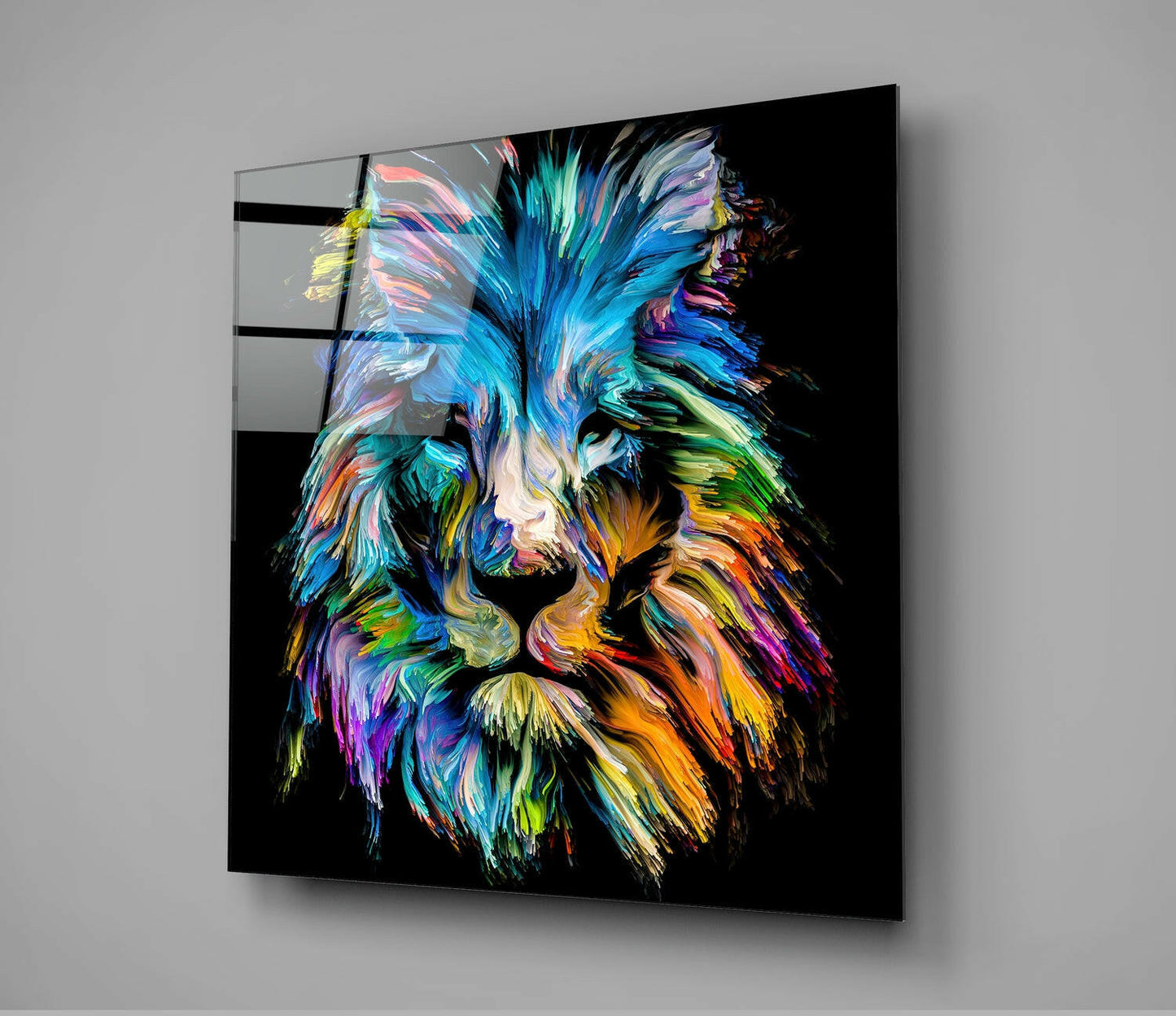Colorful abstract lion head with blue, cyan, orange, and yellow brushstroke effects on black glass panel, angled view.