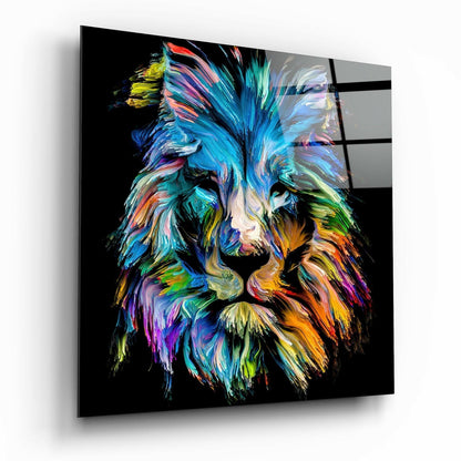 Colorful abstract lion head with vibrant blue, cyan, orange, and yellow brushstrokes on black glass panel, displayed at angle.