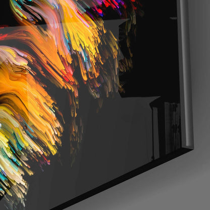 Colorful glass wall art with vibrant yellow, orange, and red brushstroke patterns displayed at an angled view against neutral background.