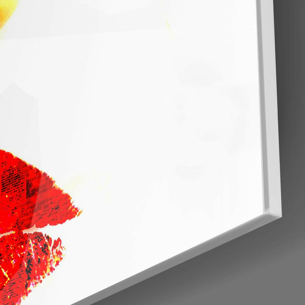 Close-up corner view of glass wall art with red and yellow painted abstract design against white background.