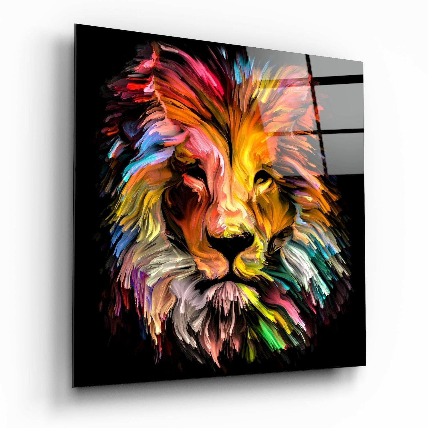 Angled perspective of a colorful lion head glass wall art with vibrant brushstroke-style paint effects in pink, yellow, blue, and orange against black background.