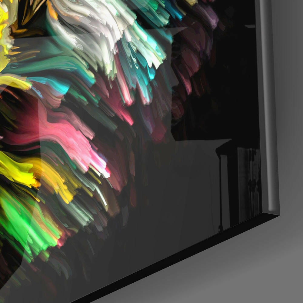 Close-up angle of colorful glass wall art showing vibrant yellow, green, pink, and white brushstroke patterns on black background.