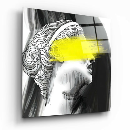 Glass wall art featuring a profile line drawing of a head with bright yellow light beam crossing the face, mounted at an angle.