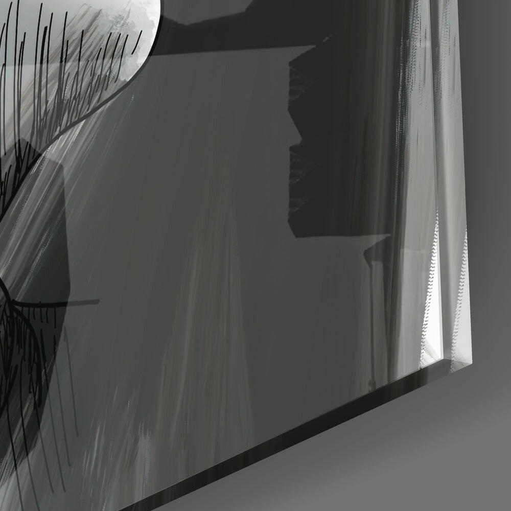 Close-up angled view of translucent glass panel with etched linear patterns and dark silhouette profile, backlit by bright window light.