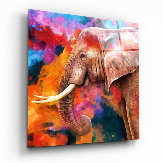 Glass wall art featuring an elephant in profile facing left, with vibrant abstract background in orange, pink, blue, and purple hues, displayed at an angle showing depth and reflection.