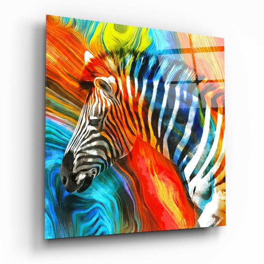 Angled perspective of glass wall art showing two zebras with overlapping striped patterns against a swirling multicolored background of orange, blue, yellow, and red.