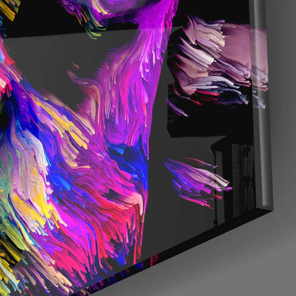 Vibrant abstract glass wall art with swirling magenta, blue, yellow, and pink brushstrokes displayed in an interior corner setting.