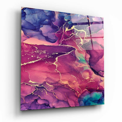 Angled perspective of glass wall art displaying abstract fluid design in pink, purple, blue, and gold with organic flowing patterns.