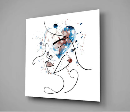 Modern line art glass wall art displaying an abstract face profile with watercolor blue and brown splashes against white background, mounted at angle.