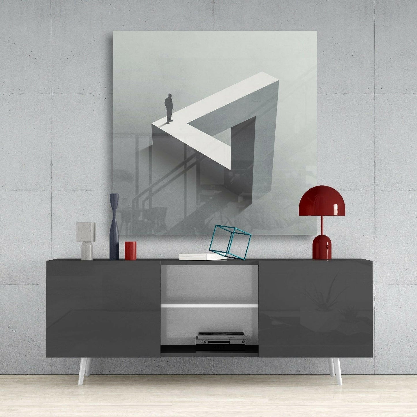 Dead End Glass Wall Art mounted above a dark gray media console, displaying a surreal 3D illustration of a figure on an impossible geometric structure in grayscale tones.