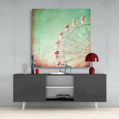 Ferris wheel canvas art with mint-to-coral gradient displayed above gray media console with red lamp and accessories.