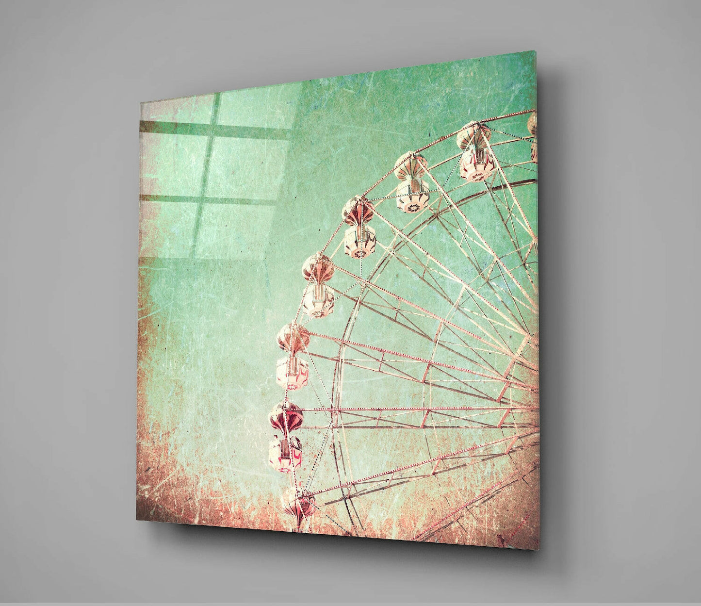 Angled view of ferris wheel glass wall art with vintage mint-green and coral distressed texture against gray background.