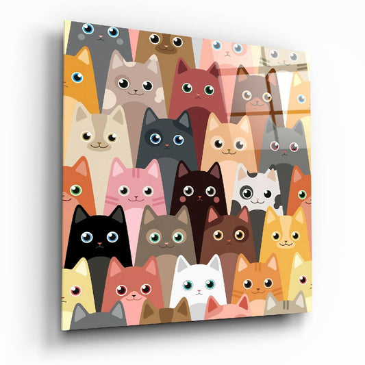 Colorful glass wall art panel displaying a grid of cartoon cat faces in various colors with large expressive eyes, shown at an angled perspective.