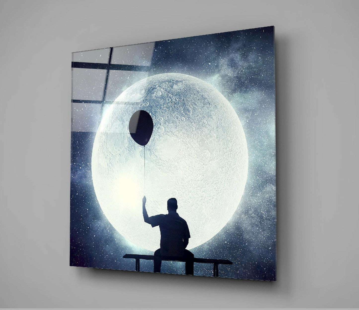 Man on Bench Holding Balloon Moon Glass Wall Art
