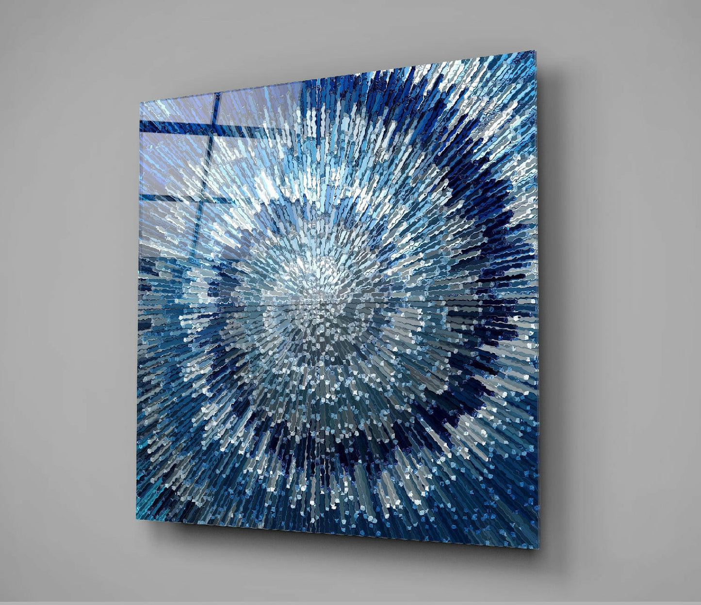 Angled perspective view of square blue glass wall art with radiating white and navy striped pattern emanating from center point.
