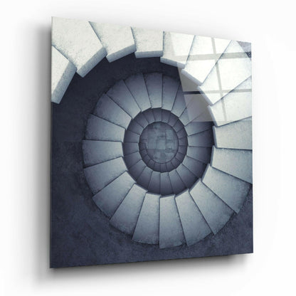 Overhead view of a circular spiral staircase descending into darkness, rendered in grayscale concrete and stone tones.