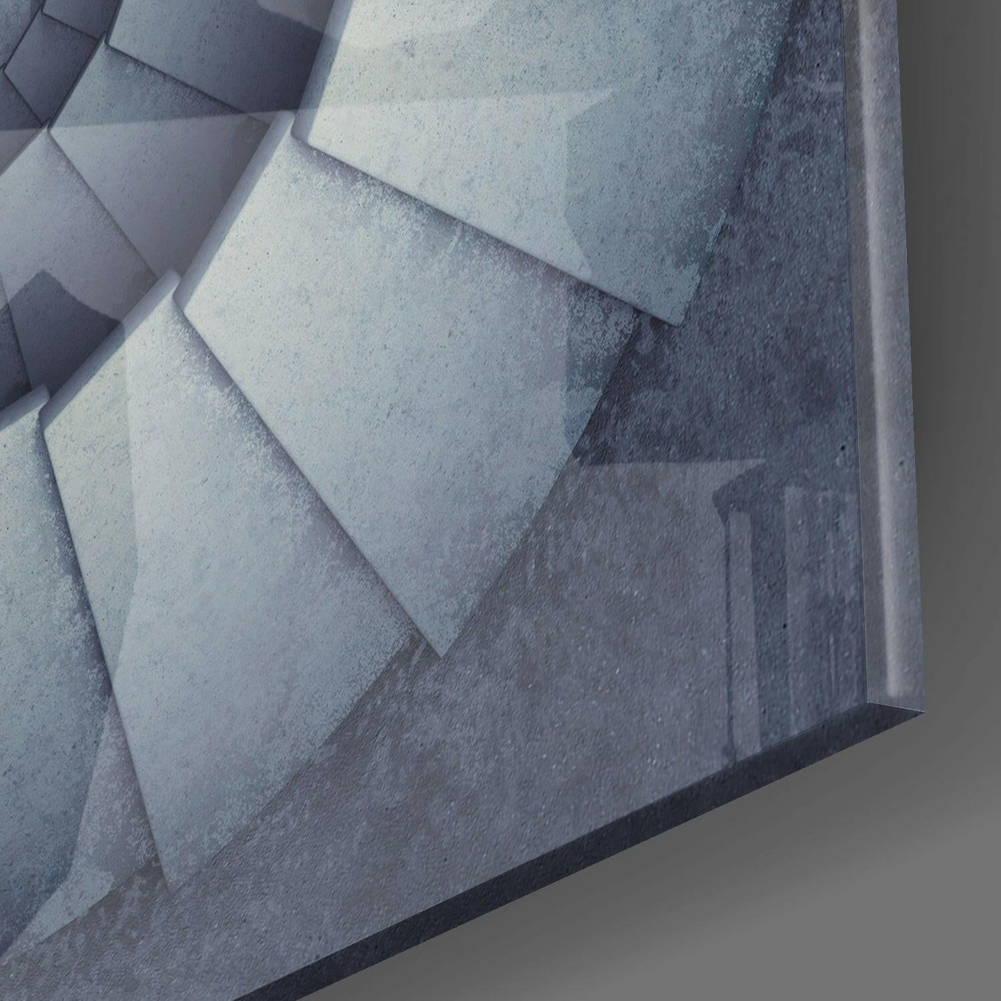 Close-up overhead view of layered concrete stair steps with light and shadow gradations, gray tones.