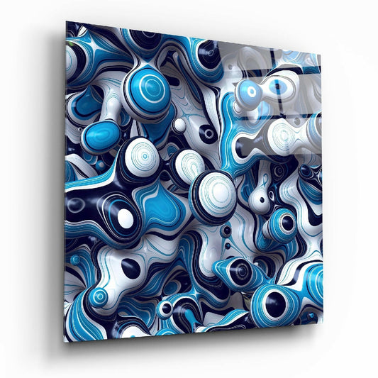 Angled view of glossy glass wall art featuring layered blue, white, and navy spheres and curved organic shapes in a three-dimensional composition.