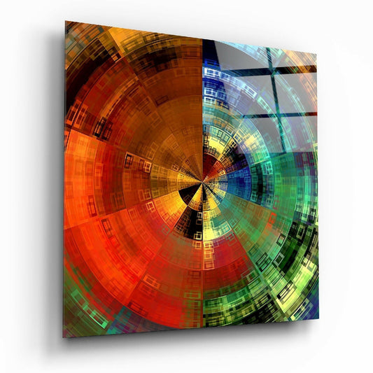 Angled perspective view of radial mosaic glass wall art displaying concentric colored squares radiating from center, with warm orange-red tones on left side transitioning to cool blue-green tones on right side.